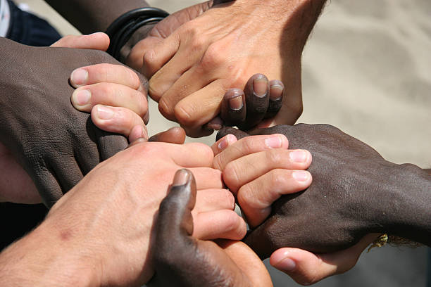 Unity 2 Black and white hands joined together racism photos stock pictures, royalty-free photos & images