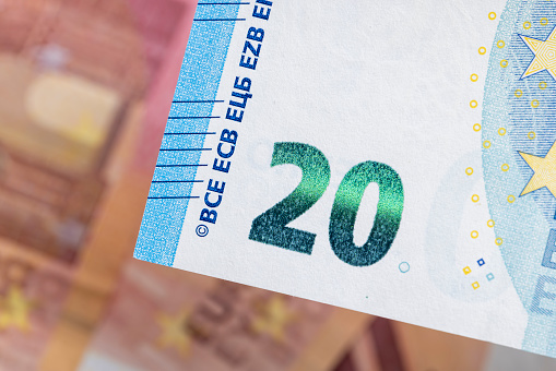 Twenty euros orange color photographed close-up, details of the genuine 20 euro banknote of the European Union