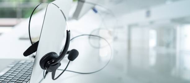 istock Headset and customer support equipment at call center ready for actively service . Corporate business help desk and telephone assistance concept . 1467711546