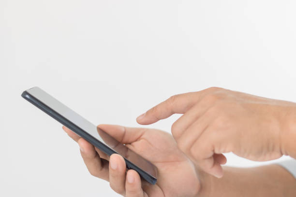 istock Close-up of a man using a mobile smartphone. Isolated hands and smartphone on white background. 1467711593
