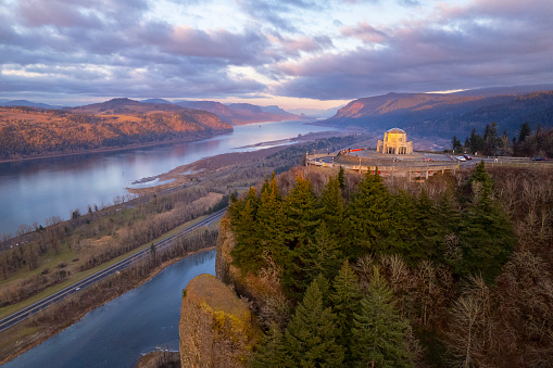 An aerial view of the Vista House at sunset in the Columbia River Gorge, Oregon.