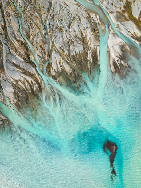istock Overhead view of Braided River Flowing into Lake. 1467719599