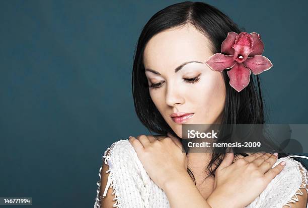 Young Gerl With Orchid Stock Photo - Download Image Now - Adult, Adults Only, Beautiful People