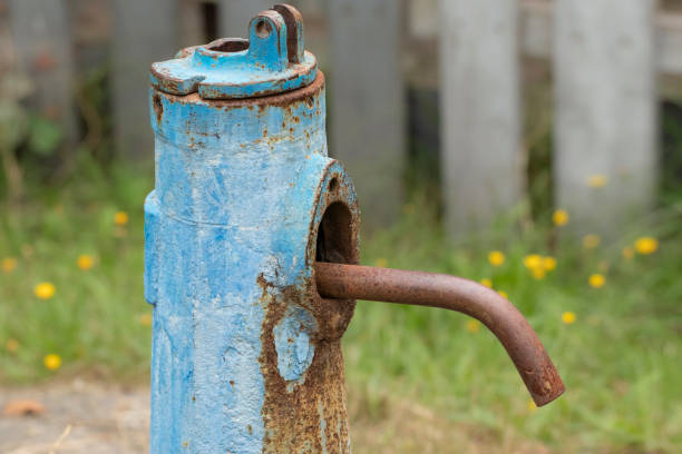 istock Old water column.Old rusty water column in the village.Alternative in the absence of centralized water supply. 1467725281