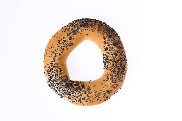 bagel with poppy seeds isolated stock photo