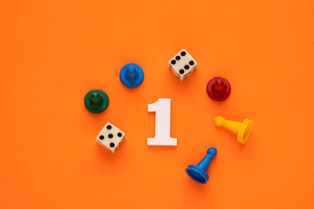 Number one in white with pieces and gambling dice - Orange eva rubber background