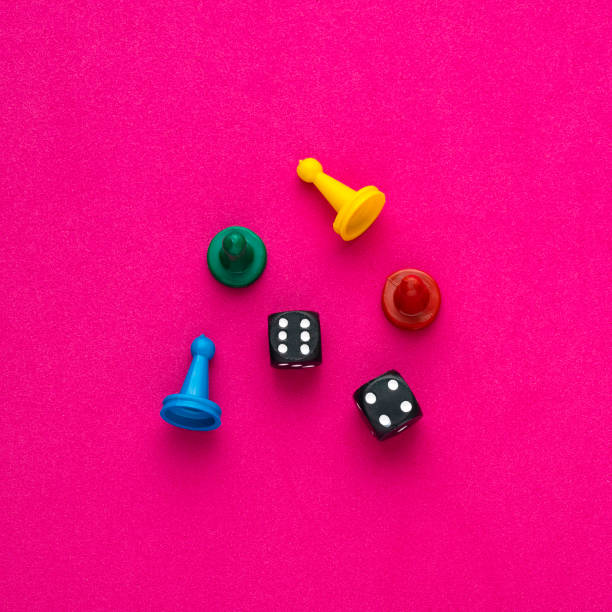 istock Board game pieces and dice - Rhodamine red eva rubber background 1467728542
