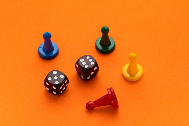 istock Board game pieces and dice - Orange eva rubber background 1467728579