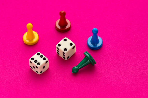 istock Board game pieces and dice - Rhodamine red eva rubber background 1467728580