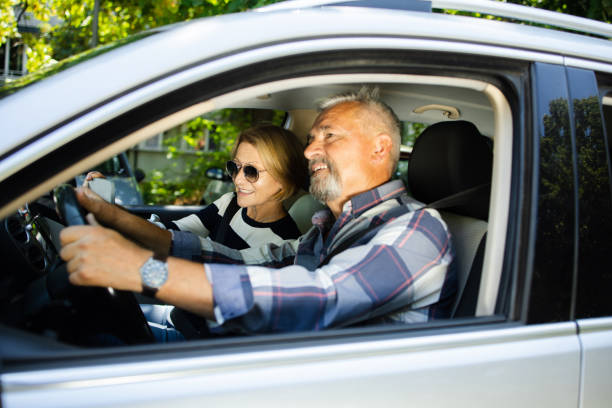 istock Senior couple going on a journey by a car 1467731590