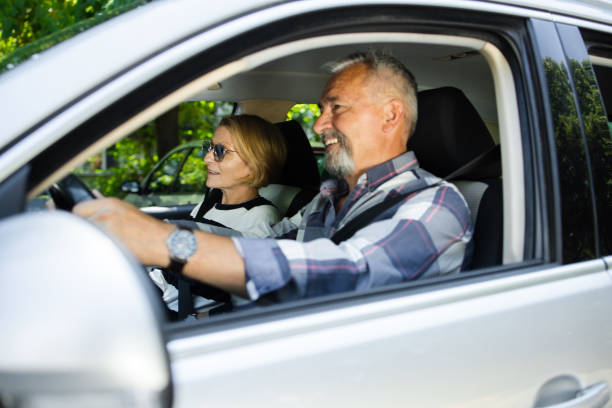 istock Senior couple going on a journey by a car 1467731595