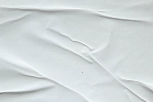 istock white crumpled and creased paper poster texture background 1467732112