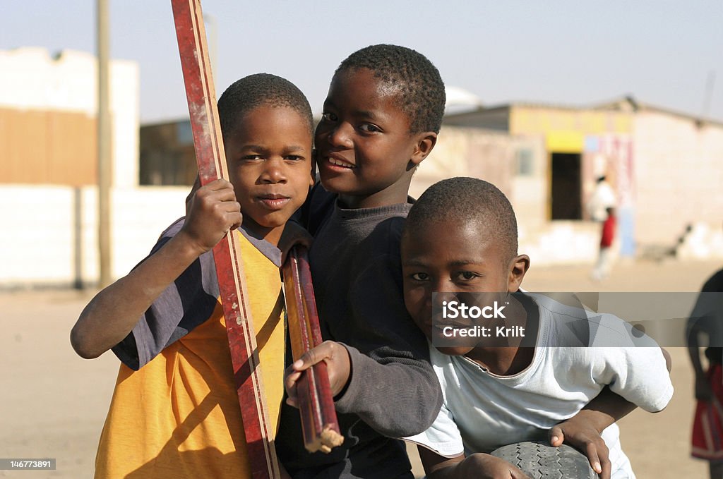 Three young African boys gathered in street Three young African boys. Complementary image: file_thumbview_approve.php?size=1&id=6022517 Namibia Stock Photo