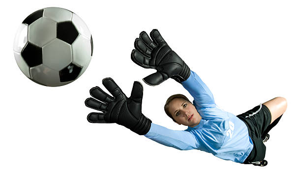 The one male soccer player goalkeeper catching ball in jumping. Silhouette of fit man with ball isolated on white studio background