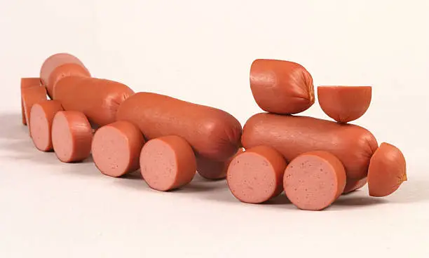 Little toy-train made of meat sausage