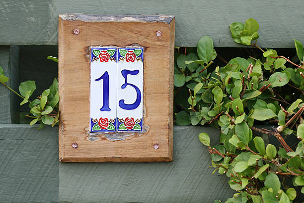 Tiled number fifteen sign for home stock photo