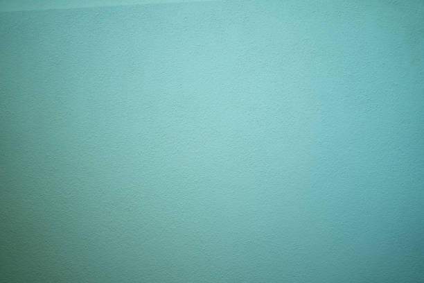 Blank concrete wall Green color for texture background. New surface looks rough. Wallpaper shape. Backdrop texture wall and have copy space for text. Painted cement Surface design banners
