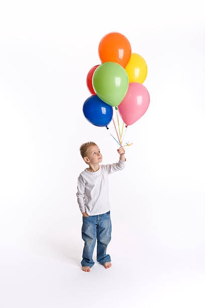 istock Little kid with colored balloons 146774237