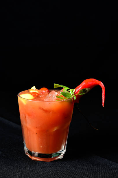 istock berry alcoholic iced drink fruit juice with cinnamon isolated on black background 1467742745