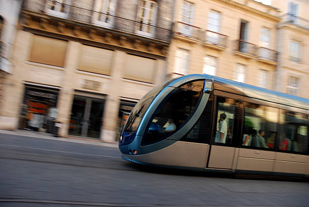 istock Fast Moving Tram Speeding Trough Shopping District 146774440
