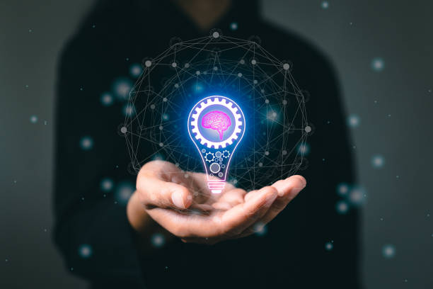 istock Hand with light bulb and brain icon futuristic future digital technology. Success creativity invention, thinking imagination marketing online. Innovation for modern business intelligence concept. 1467748857