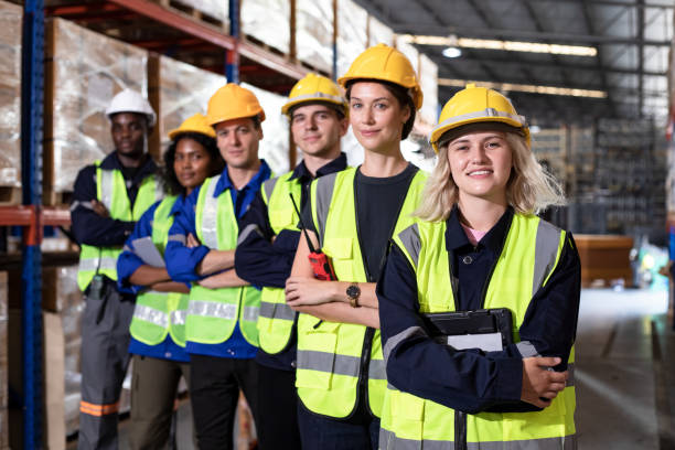 istock Group of smiling worker standing together at logistic distribution warehouse, Teamwork concept 1467750252