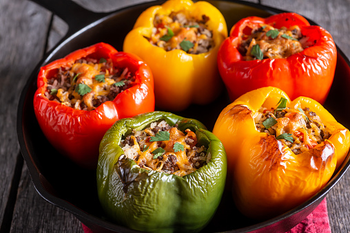 Pile of mini bell peppers paprika isolated on white background