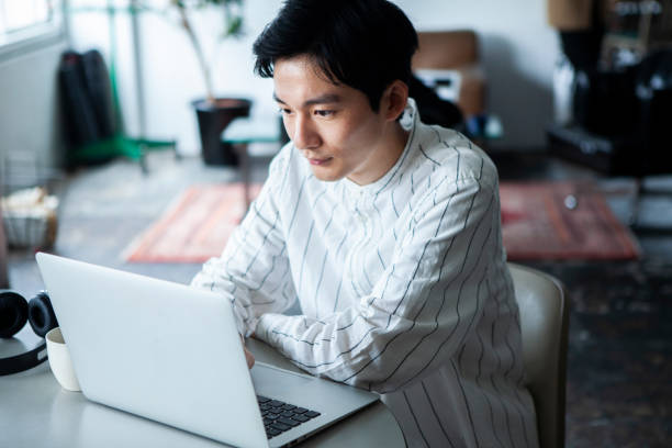 istock Pensive man working on laptop in the office 1467754623