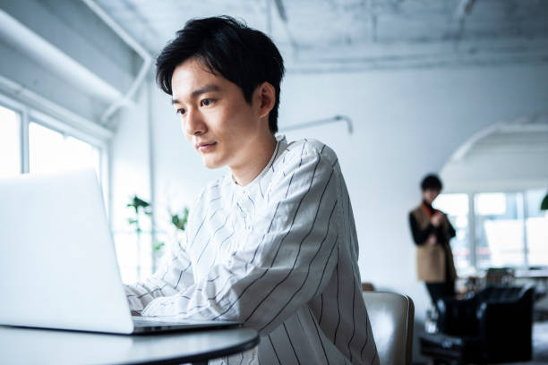 istock Pensive man working on laptop in the office 1467754640