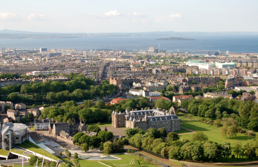 View of Edinburgh from Arthur's Seat with The Palace of Holyrood in the foreground, the official residence of Her Majesty in Scotland