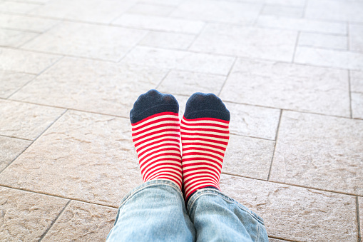 Woman's feet with colorful socks. Sport, style and healthy lifestyle concept.