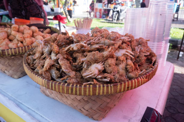 istock Crispy fried baby crab snacks sold at culinary festivals 1467759262