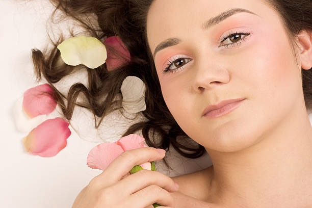 istock beauty woman with rose 146776024