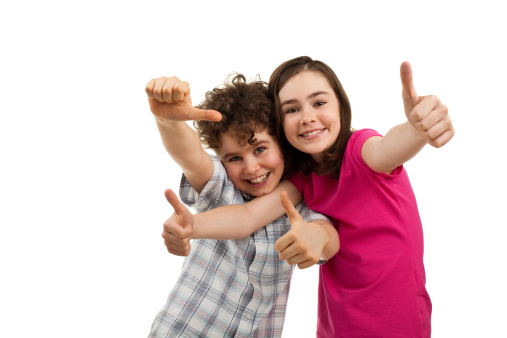 Portrait of two successful kids isolated on white background