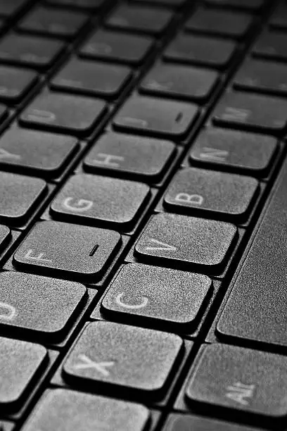 Black laptop keyboard set at an angle