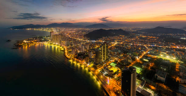 Drone view of Nha Trang city at sunset from the sea, Khanh Hoa province, central Vietnam