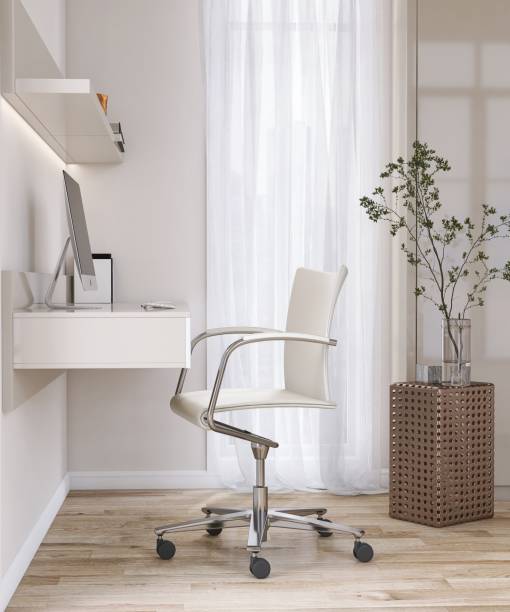 istock Minimal built in beige working desk with computer, shelf, leather office chair, blank cream wall, parquet floor in sunlight from window with white curtain 1467766492