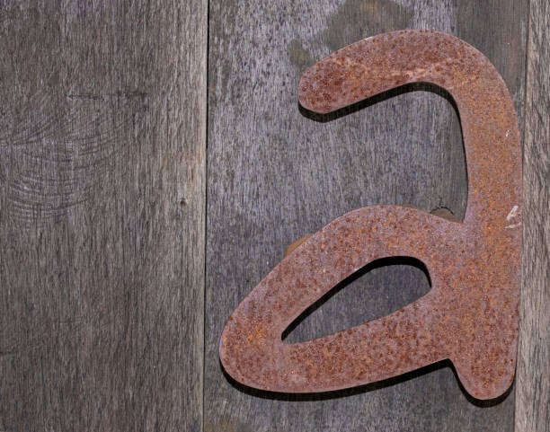 istock Copper letter A on wood planks background and wallpaper texture 1467769294