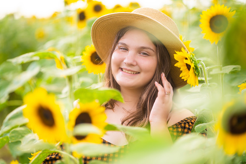 Cuban girl on sunflower field