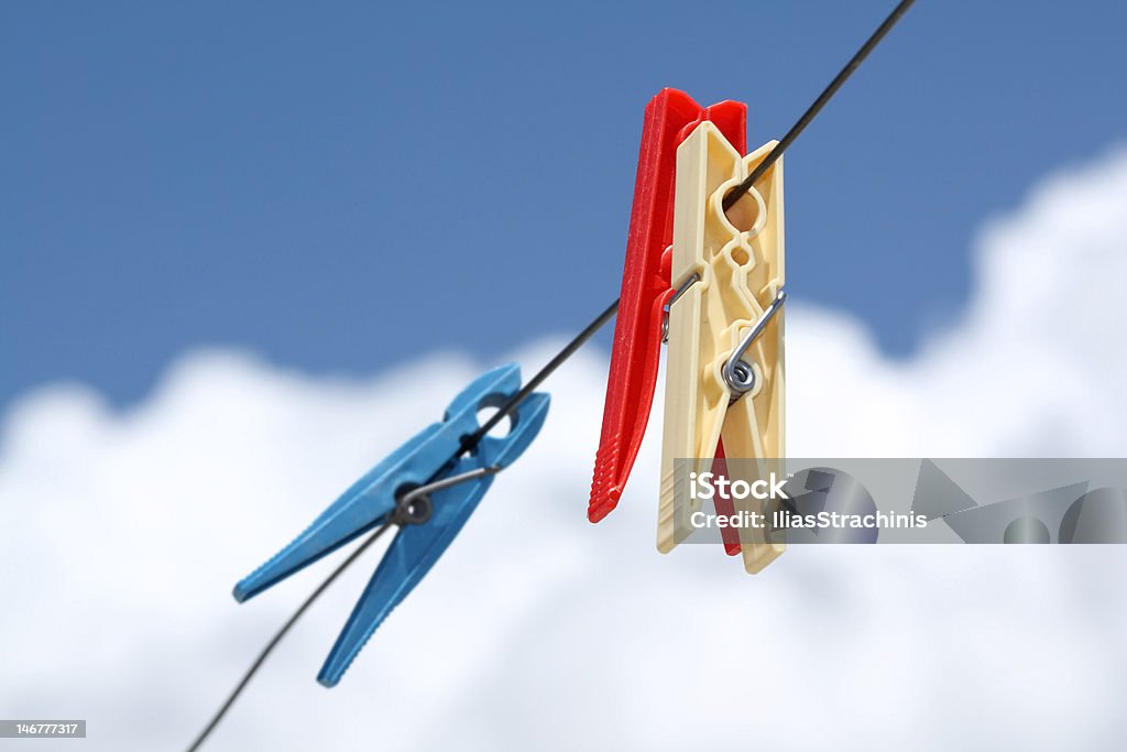Clothes pegs Clothes pegs on a wire Blue Stock Photo