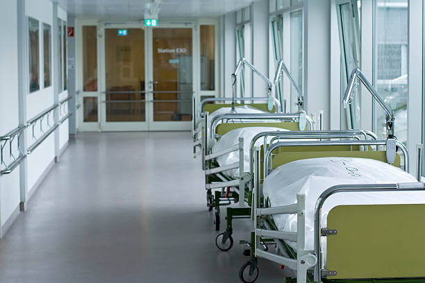 istock Hospital corridor with empty beds in a line 146777658