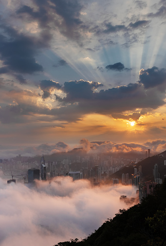 Sunrise over Hong Kong city in fog
