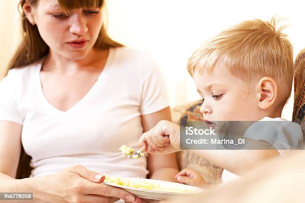 Mother Feeding Her Son Stock Photo - Download Image Now - 12-17 Months, Adult, Baby - Human Age