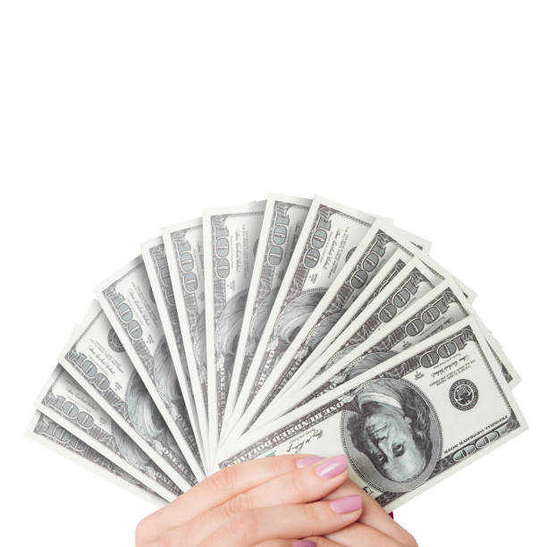 istock Hand with money isolated on a white background 1467782120
