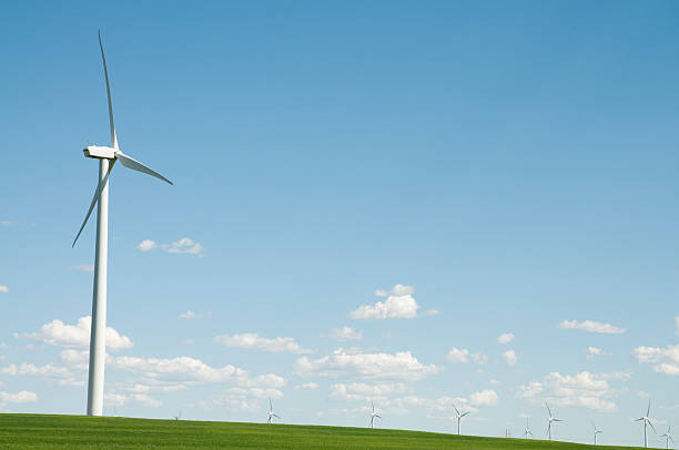 Windfarm Windmill with wind farm in the background theishkid stock pictures, royalty-free photos & images