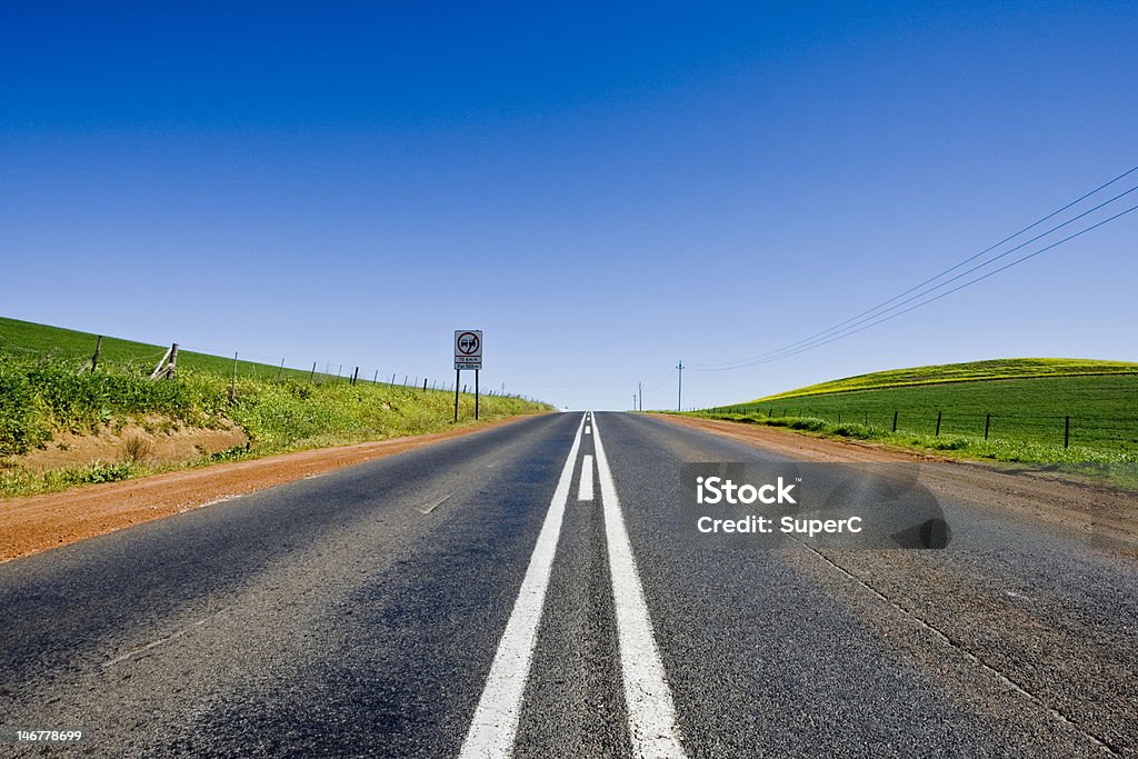 Country Road A dead straight country road, running through the Cape Town wine lands district. Africa Stock Photo
