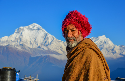 Shikha, Nepal - Oct 25, 2017. Portrait of Nepali man on mountain at Khopra Village in Shikha, Nepal.