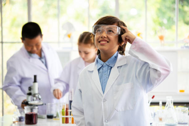 Free Stock Photo of Little scientists children is looking at erlenmeyer ...