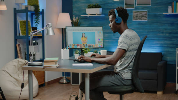 istock Photography editor with headphones working with retouch app 1467791051