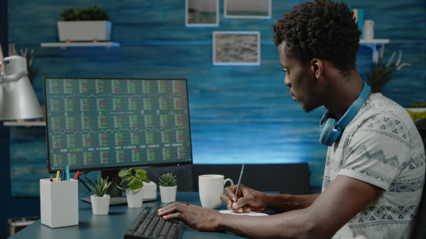 istock Person looking at stock market trading data on computer 1467791367